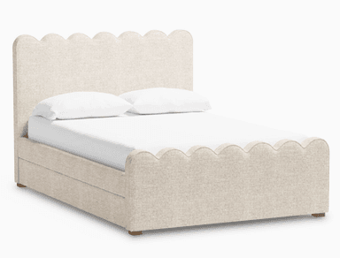 A contemporary upholstered platform bed featuring a distinctive scalloped design on both the headboard and footboard. The bed frame is covered in a light-colored, textured fabric, likely a linen or bouclé blend, and rests on subtle wooden block feet. It includes a mattress and two pillows with white bedding. — 3D model