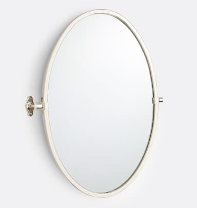 An oval-shaped wall-mounted mirror featuring a slim, polished metal frame and a pivoting mechanism. The mirror is attached to a decorative wall bracket, allowing it to be tilted for adjustable viewing angles. The metallic finish appears to be polished nickel or chrome, providing a sleek and contemporary aesthetic. — 3D model
