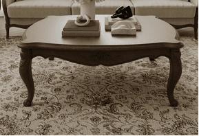 An elegant classical chaise lounge featuring a dark wood frame and light cream-colored upholstery. The frame exhibits distinctive scrolled and carved elements, particularly on the backrest/armrest and the base. The design suggests a refined, antique aesthetic, often associated with Regency or Empire styles. The upholstery is a plain, light fabric, providing a contrast to the dark wood. — 3D model