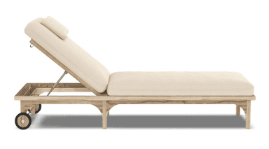 An outdoor chaise lounge featuring a natural light-toned wooden frame and thick cream-colored cushions. The backrest is adjustable via a metal mechanism, allowing for various reclining positions. It includes a small, rectangular headrest pillow. Two wheels are integrated into the frame at the head end for easy mobility, while the foot end rests on four sturdy legs with an arched design. The overall aesthetic is clean and functional, suitable for outdoor relaxation. — 3D model