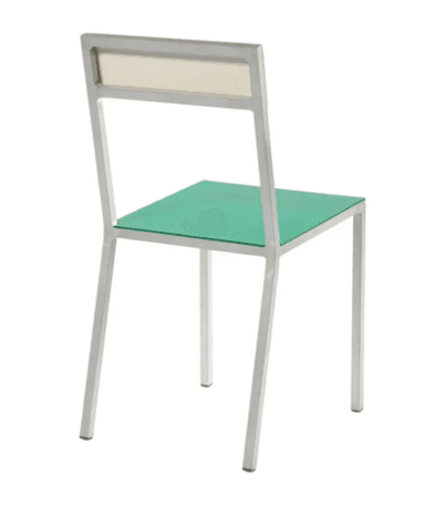 A modern side chair with a minimalist design. The frame is constructed from silver-toned metal, likely aluminum or steel, with clean lines and square profiles. The seat is a flat, rectangular panel of translucent green material, possibly colored glass or acrylic. The backrest consists of a horizontal element of a cream or off-white color, set within the upper portion of the metal frame. The chair has four legs of the same metal, providing a sturdy base. — 3D model