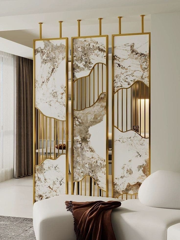 A set of three decorative room divider panels, each featuring a polished brass frame with sections of white and grey marble-effect material and vertical brass slats. The marble-effect inserts have curved, organic cutouts that contrast with the linear brass elements. — 3D model