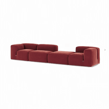 A long, modular sectional sofa composed of five individual upholstered units, including two end pieces with integrated armrests, two armless seat sections, and one ottoman/chaise section. The sofa is upholstered in a plush reddish-brown velvet fabric, featuring a low-slung profile and soft, rounded block-like forms. — 3D model