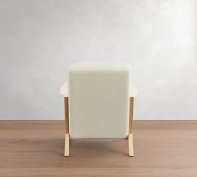 A modern armchair with a light-colored upholstered seat, back, and armrests, supported by a light wood frame. The frame consists of four legs, with the front legs extending upwards to form the armrests, and a connecting horizontal piece. — 3D model