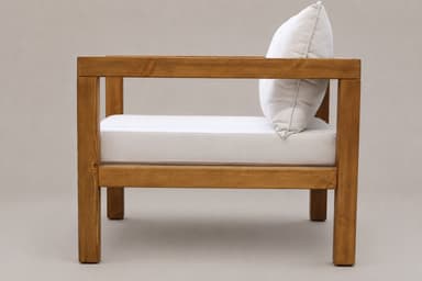 A sturdy armchair featuring a robust wooden frame and plush, light-colored cushions for seating and back support. The design is rectilinear and minimalist. — 3D model
