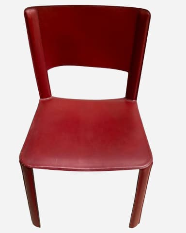 A modern side chair upholstered in red leather. The chair features a minimalist design with a continuous seat and backrest that forms integrated legs. The upholstery is stitched along the edges, creating a clean, tailored appearance. The backrest has a cutout at the top center. — 3D model