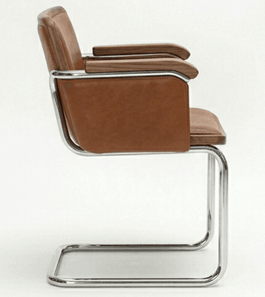 A cantilever armchair featuring a tubular chrome-plated steel frame. The seat, backrest, and armrests are upholstered in brown leather. The armrests also incorporate wooden accents, likely walnut, adding a touch of warmth and contrast to the metal and leather. — 3D model