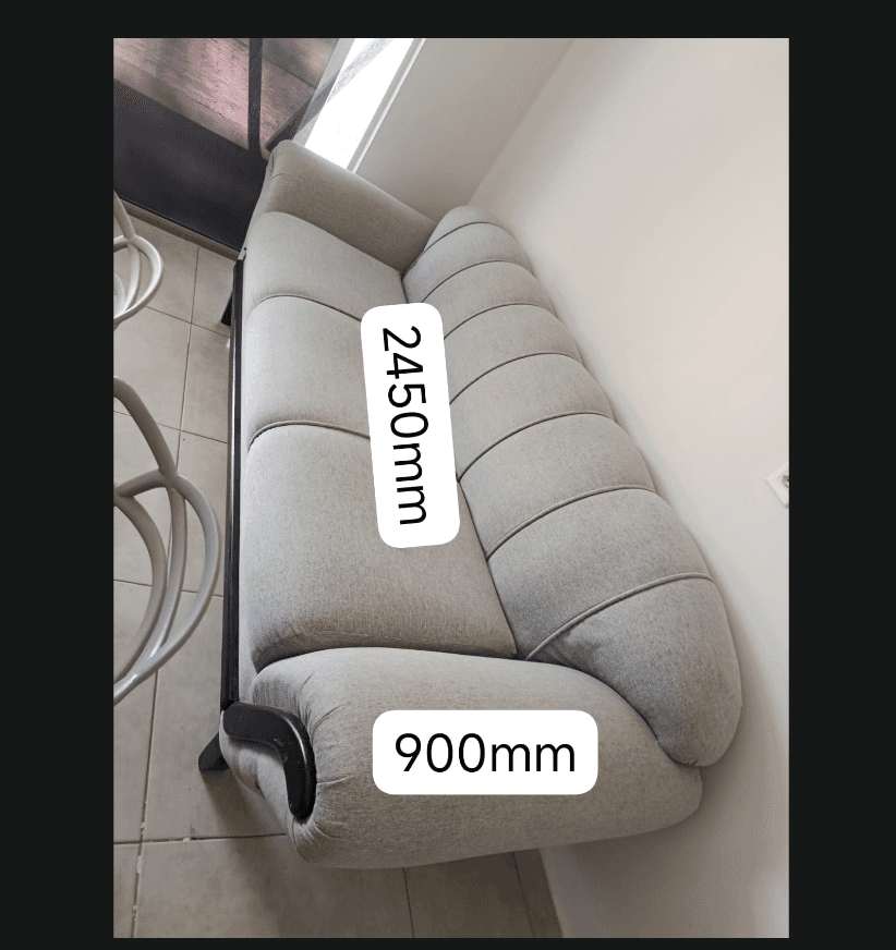 A light grey two-seater sofa featuring a distinctive channel-tufted backrest and two separate seat cushions. The sofa is supported by an exposed dark wooden frame, which extends to form curved accents on the outer portion of the rolled armrests. The design blends traditional elements with a modern sensibility. — 3D model