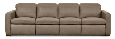 A four-seater sofa with plush cushions and a streamlined design. The sofa features distinct seat cushions and back cushions, with visible stitching along the edges. It has square arms and is supported by short, dark wooden legs. — 3D model