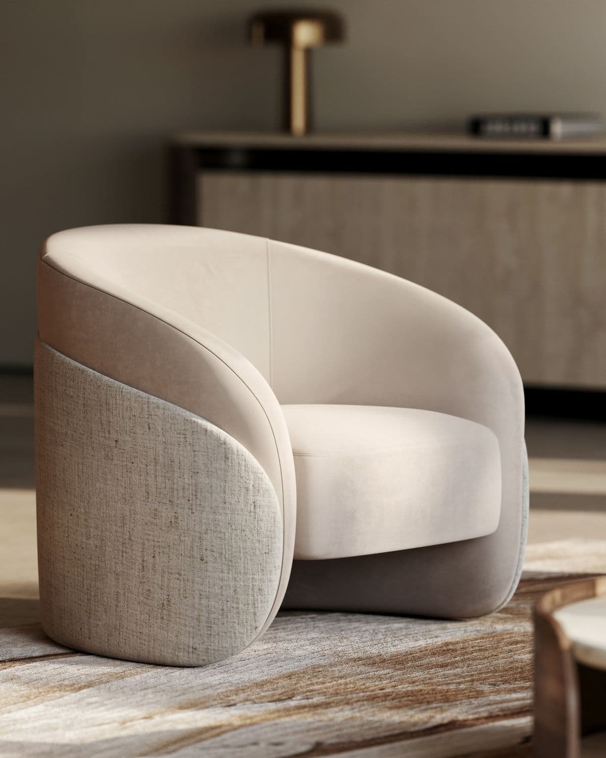 A modern barrel-style chair featuring two-tone upholstery. The inner seat, back, and armrests are upholstered in a smooth, light beige or cream fabric, while the outer shell and sides are covered in a textured, woven light gray or natural linen-like fabric. The chair has a rounded, cohesive form with no visible legs, giving it a low-profile and contemporary aesthetic. — 3D model