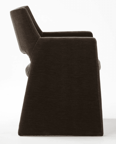 A dark brown fully upholstered armchair featuring a modern, monolithic design. The chair has a wide, slightly curved backrest, integrated armrests, and a sturdy, block-like base, all seamlessly covered in a plush, velvet-like fabric. — 3D model