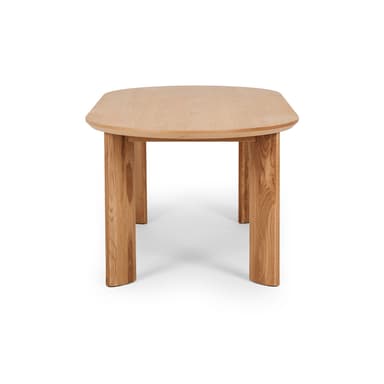 An oval dining table crafted from light-colored solid oak wood, featuring a smooth, rounded tabletop and four thick, rectangular-profile legs. — 3D model