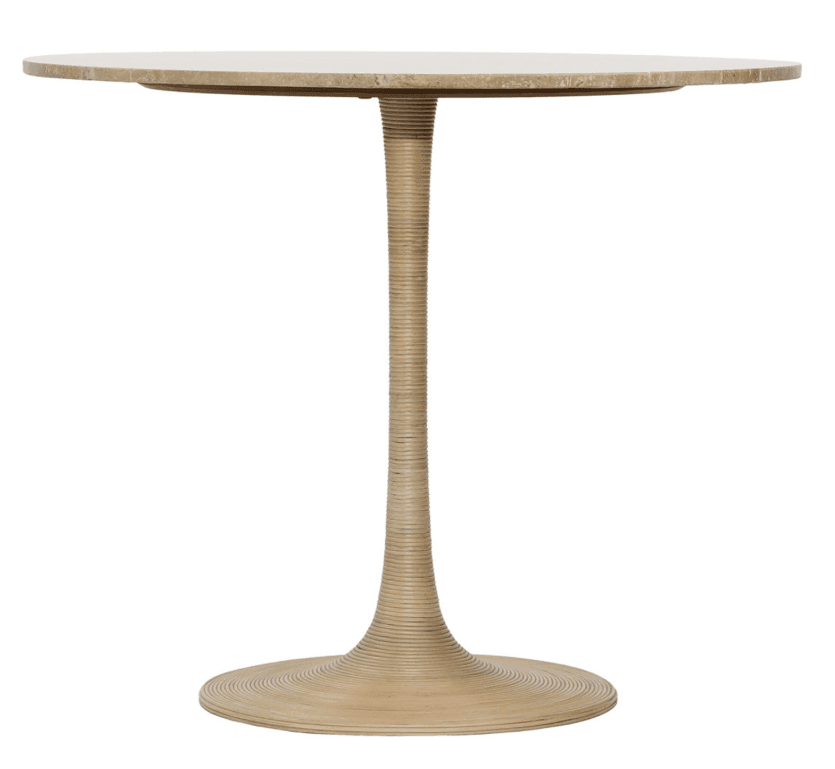 A round accent table featuring a natural travertine top and a distinctive fluted pedestal base. The base is tapered, starting wider at the bottom and narrowing towards the top, and appears to be constructed from or covered in a woven rattan material, giving it a textured, organic aesthetic. The overall color palette is natural, ranging from light beige to cream tones, characteristic of travertine and rattan. — 3D model