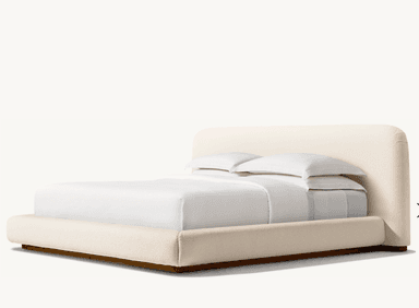 A low-profile bed frame with a rounded headboard and platform base, upholstered in a textured, light-colored fabric. The bed is dressed with white bedding, including two pillows stacked neatly. — 3D model