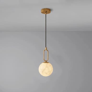 A modern pendant light featuring a brass-finished canopy and frame, supporting a spherical shade with a white marble-like pattern. — 3D model