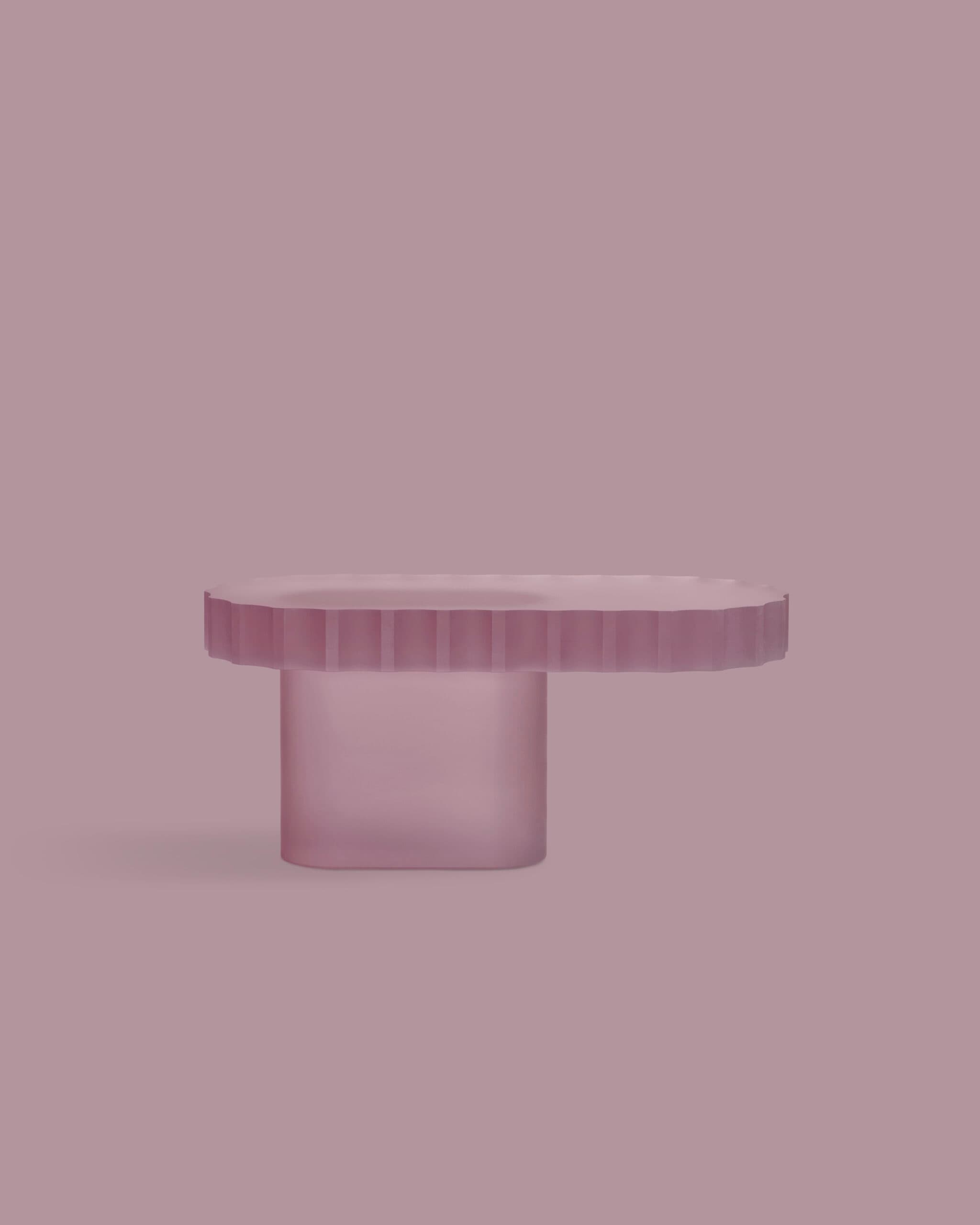 A side table with an oval-shaped top and a single, thick cylindrical pedestal base. The top has a fluted or ribbed edge detail. The material appears to be translucent, colored acrylic or resin, with a matte or frosted finish. — 3D model