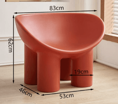 A low-profile, single-piece molded chair featuring a deep, cradling seat and backrest, supported by three thick, cylindrical legs. The entire structure is rendered in a matte reddish-brown finish, exhibiting smooth, rounded contours throughout its minimalist design. — 3D model