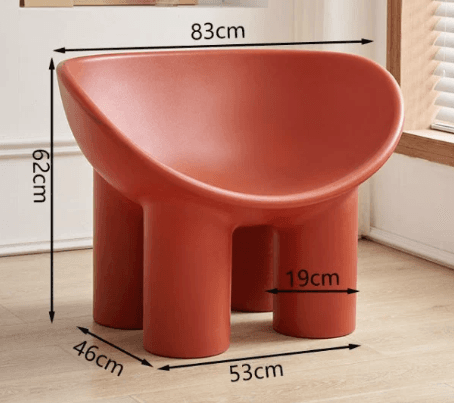 A low-profile, single-piece molded chair featuring a deep, cradling seat and backrest, supported by three thick, cylindrical legs. The entire structure is rendered in a matte reddish-brown finish, exhibiting smooth, rounded contours throughout its minimalist design. — 3D model