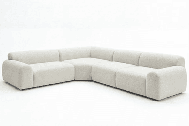 An L-shaped modular sectional sofa upholstered in a light, textured bouclé fabric, featuring rounded edges and a low-profile design, against a plain white background. — 3D model