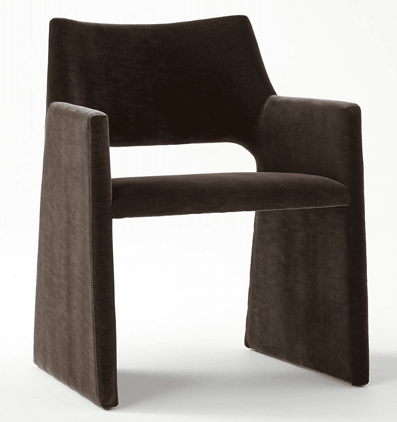 A dark brown fully upholstered armchair featuring a modern, monolithic design. The chair has a wide, slightly curved backrest, integrated armrests, and a sturdy, block-like base, all seamlessly covered in a plush, velvet-like fabric. — 3D model