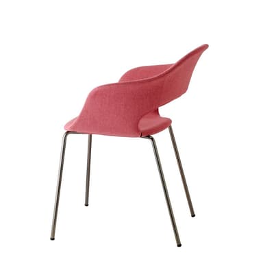 A modern dining or accent armchair featuring a curved, shell-shaped seat and back with integrated armrests, upholstered in a reddish-pink fabric. A distinctive oval cutout is present in the lower backrest. The chair is supported by four slender, straight metal legs that splay slightly outwards. — 3D model