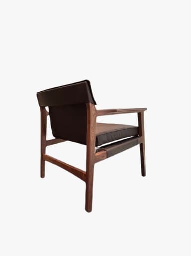 A mid-century modern armchair featuring a solid dark wood frame and dark brown leather upholstery. The chair has a minimalist design with straight lines, exposed wooden armrests, and subtly tapered legs. It includes separate seat and back cushions for comfort. — 3D model
