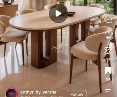 An oval-shaped coffee table featuring a light-colored top and two dark wood pedestal bases. The bases have distinctive rounded, arch-like cutouts, giving them a sculptural and modern appearance. The overall design is minimalist and contemporary. — 3D model
