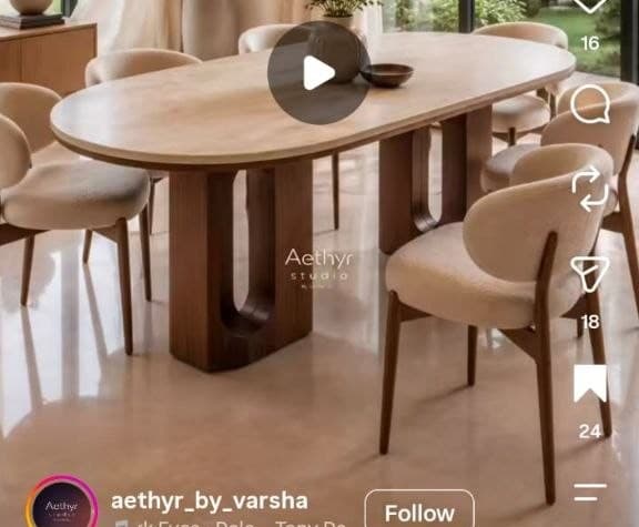 An oval-shaped coffee table featuring a light-colored top and two dark wood pedestal bases. The bases have distinctive rounded, arch-like cutouts, giving them a sculptural and modern appearance. The overall design is minimalist and contemporary. — 3D model