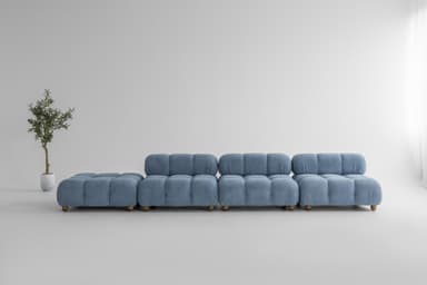 A modular sofa with a low profile and rounded, tufted cushions. The sofa is upholstered in a textured blue fabric and features a linear configuration with multiple sections, including a chaise lounge element on the left. Small wooden legs are visible supporting the structure. — 3D model