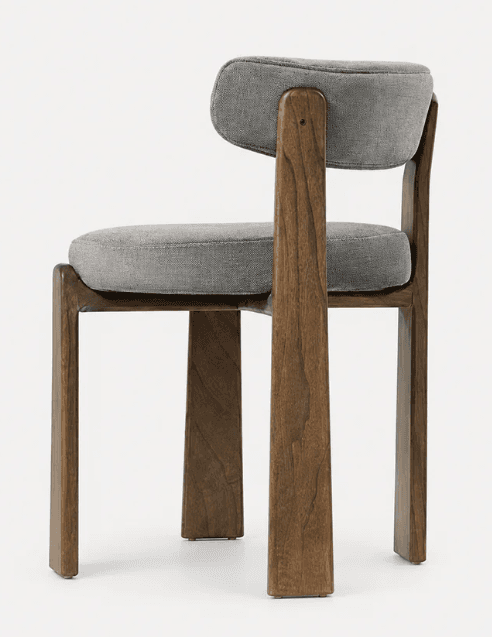 An armless chair featuring a robust dark brown solid wood frame and light gray fabric upholstery on the seat and backrest. The design is minimalist with clean lines, showcasing a contemporary aesthetic. The backrest is attached to vertical wooden supports that extend upwards from the rear legs, creating a visually integrated structure. The seat and back cushions are well-padded and have softly rounded edges. — 3D model