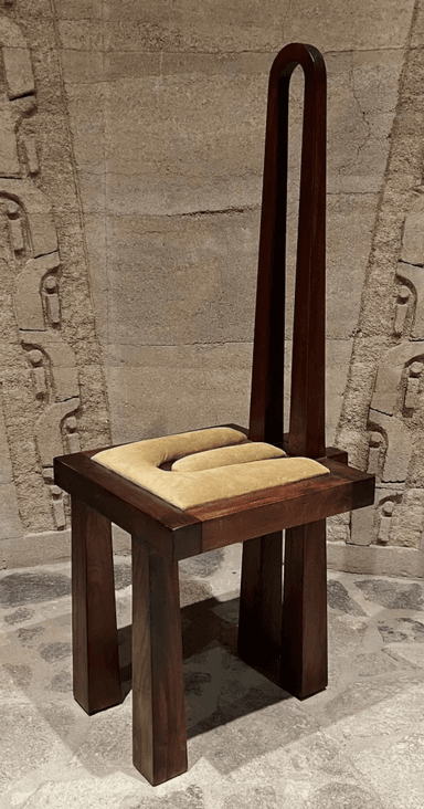 A distinctive high-back chair featuring a dark brown wooden frame and a light beige U-shaped upholstered seat cushion. The backrest is formed by two exceptionally tall, slender, U-shaped wooden elements that extend far above the seat. The frame has a blocky, architectural construction with integrated armrests defined by the seat structure. Its design is highly sculptural and unconventional. — 3D model