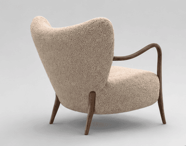 An armchair featuring a rounded, plush silhouette upholstered in a cream or beige bouclé fabric. It has visible, smoothly curved dark wooden armrests that extend downwards to form the front legs, and splayed wooden back legs. The backrest is slightly flared, providing a comfortable seating experience. — 3D model