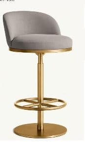 A contemporary bar stool featuring a round upholstered seat and a curved backrest, supported by a central brass-finished metal pedestal base with a circular footrest and a disc-shaped bottom plate. — 3D model