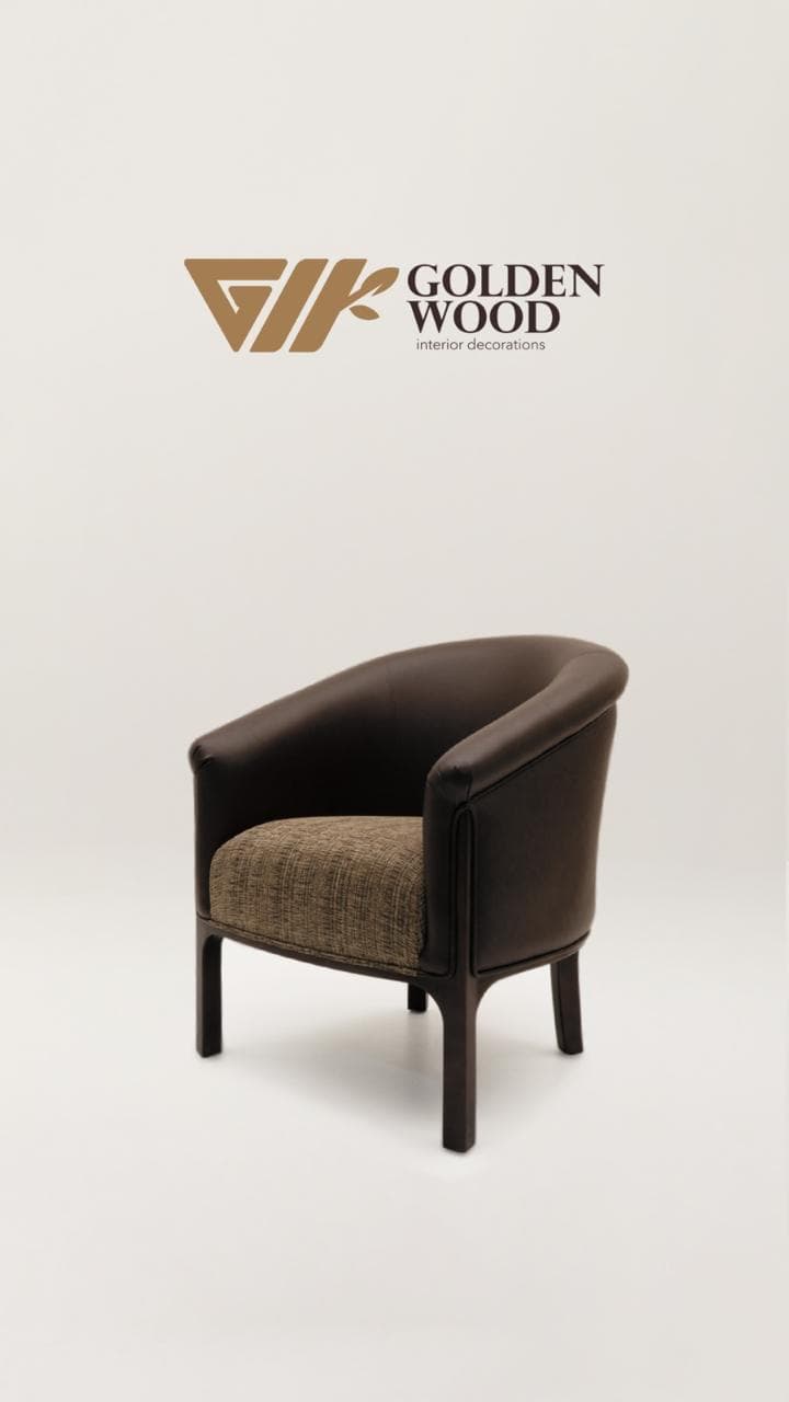 A modern tub armchair featuring a continuous, rounded back and armrest upholstered in dark brown, with a contrasting textured fabric seat in shades of beige and brown. It stands on four sturdy dark-stained wooden legs. — 3D model