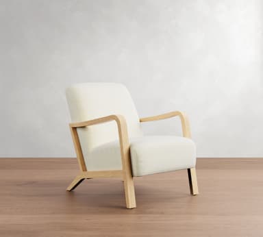 A modern armchair with a light-colored upholstered seat, back, and armrests, supported by a light wood frame. The frame consists of four legs, with the front legs extending upwards to form the armrests, and a connecting horizontal piece. — 3D model