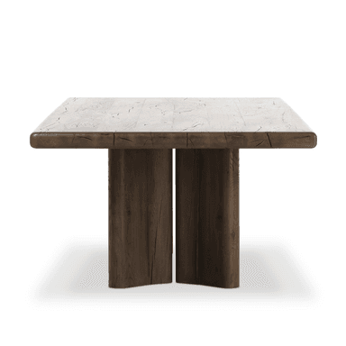 A rectangular dining table with a thick, solid wood top featuring a light, weathered finish and pronounced wood grain patterns. The base consists of two substantial, vertical wooden supports with rounded edges, finished in a darker, rich brown tone. The overall design evokes a rustic or natural aesthetic. — 3D model
