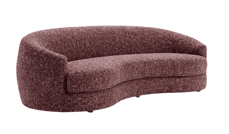 A contemporary, two-to-three-seater sofa featuring a distinctive curved silhouette, upholstered entirely in a textured bouclé fabric. The sofa has a low profile with integrated, rounded armrests and a continuous backrest. The color is a deep, muted burgundy or mauve. It appears to be a modern piece designed for comfort and aesthetic appeal. — 3D model