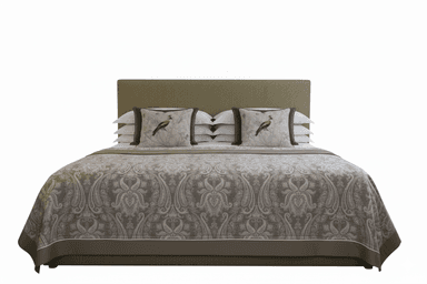 A side profile view of a bed with a fabric-covered headboard and frame. The bed is made with white sheets, layered pillows (some decorative with dark green and patterned covers), and a decorative throw blanket with a damask pattern in neutral tones. The frame and headboard appear to be upholstered with a ribbed fabric. — 3D model