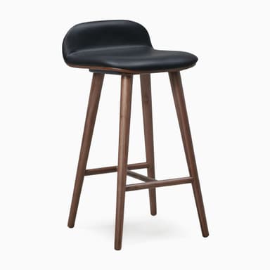 A modern bar stool featuring a black upholstered seat and backrest, supported by a splayed dark walnut wood frame with integrated footrests. — 3D model