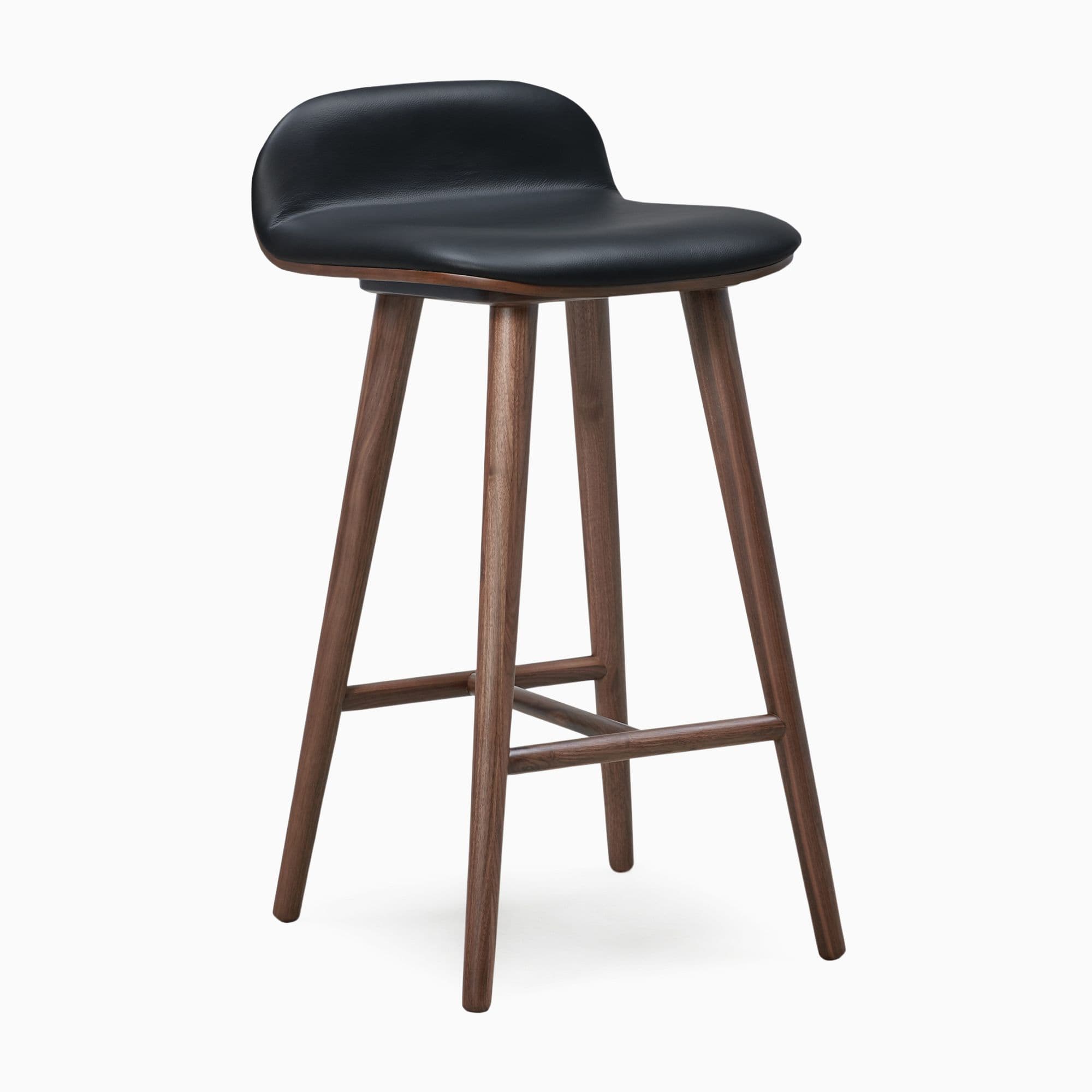 A modern bar stool featuring a black upholstered seat and backrest, supported by a splayed dark walnut wood frame with integrated footrests. — 3D model