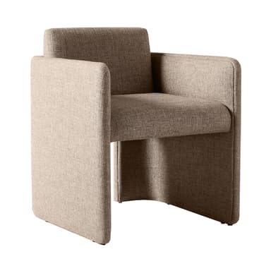 A contemporary armchair with a unique, geometric silhouette. The piece features a modular appearance with distinct, block-like sections forming the seat, backrest, and armrests. The upholstery is textured, suggesting a woven fabric. The overall form is solid and angular, yet the rounded edges of the visible surfaces provide a softer aesthetic. — 3D model