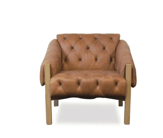 A contemporary lounge chair featuring tufted tan leather upholstery and an exposed light-colored wooden frame that forms the armrests and legs. — 3D model