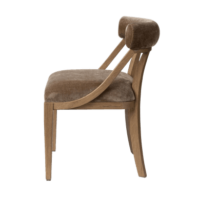 An armless dining chair featuring a light wood frame and velvet upholstery on the seat and a distinctive curved backrest. The chair exhibits a minimalist and contemporary design. — 3D model