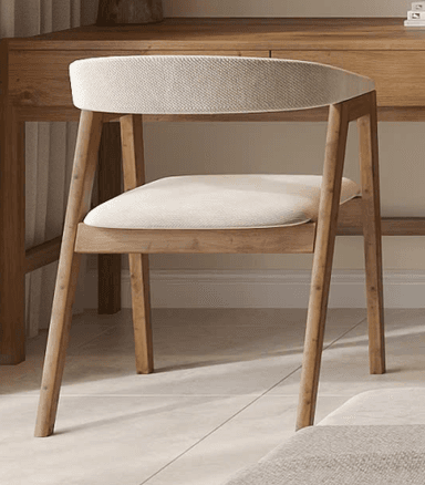 A contemporary armchair featuring a light-toned wooden frame and cream-colored upholstered seat and backrest. The backrest curves seamlessly to form integrated armrests, and the legs are slender and tapered. — 3D model
