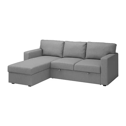 A sectional sofa with a chaise lounge on the left side. The sofa features three back cushions and a chaise extending from the left end. The frame appears upholstered in a textured light gray fabric. There are visible pull-tabs on the front of the sofa base, suggesting storage compartments or a pull-out bed functionality. — 3D model