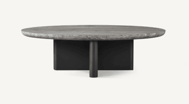 A modern coffee table with a round, textured stone top and a dark, rectangular base with cylindrical legs. The top has a naturalistic, slightly irregular edge. The base appears to be made of metal, with a matte finish. — 3D model