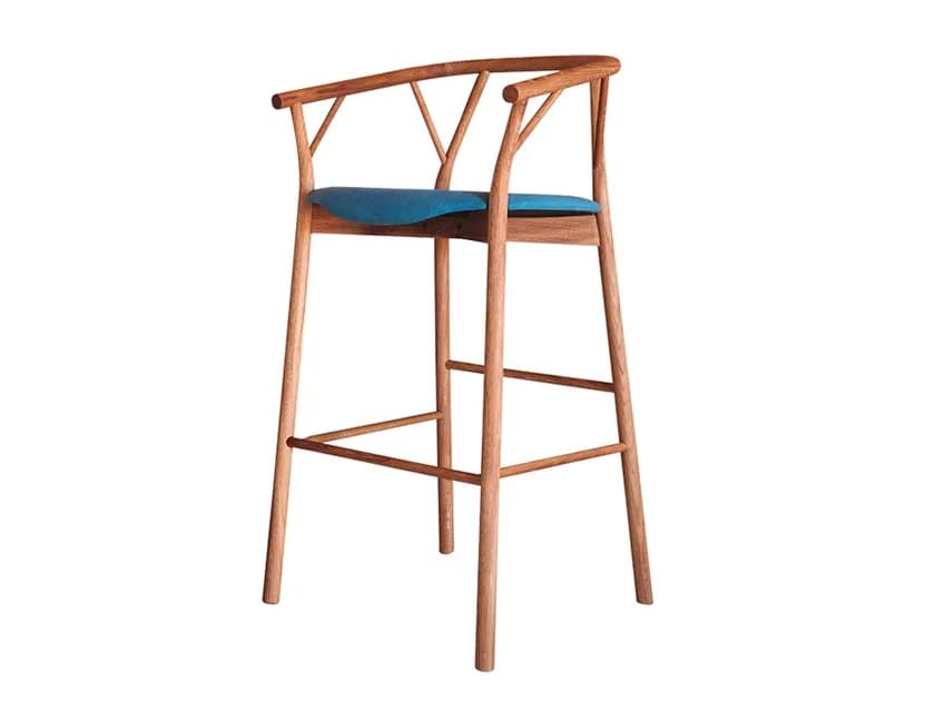 A wooden bar stool with a curved backrest and a cushioned seat. The stool features four slender legs connected by stretchers for stability. The backrest is composed of a curved wooden top rail supported by two angled wooden pieces connecting to the seat frame, with a central V-shaped brace. — 3D model