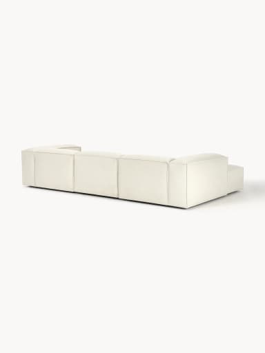 A modular sofa with clean lines and a low profile. It appears to be upholstered in a textured fabric and consists of multiple sections, suggesting flexibility in configuration. The sofa has a contemporary design with a boxy silhouette and visible stitching that delineates the segments. — 3D model