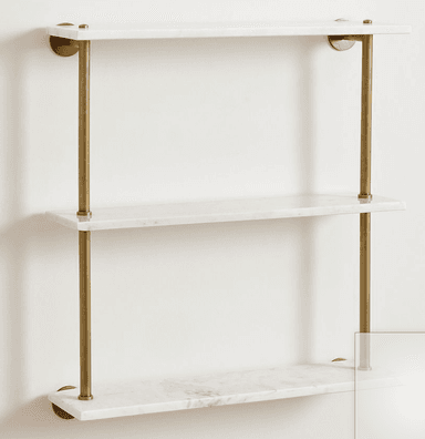 A three-tier wall-mounted shelving unit featuring rectangular white marble shelves supported by slender, vertical brass rods. The design is minimalist and elegant, suitable for modern interior spaces. — 3D model