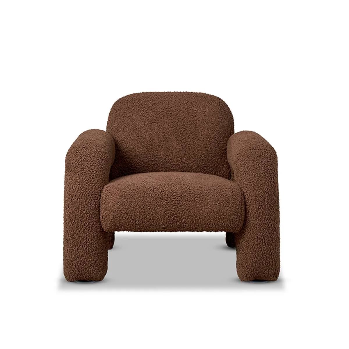 A modern armchair upholstered in a plush, textured teddy fabric. This chair features a rounded, enveloping silhouette with substantial, integrated armrests that flow seamlessly into the back and seat. Its thick cushioning and tactile surface invite comfort and relaxation. The overall design is contemporary, with clean lines and a soft, inviting appearance, supported by a sturdy, low-profile base. — 3D model